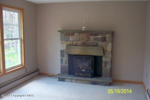 6461 Laurel Road Pocono Summit, PA 18346 - Photo 2 of 7 Living room w/Fireplace