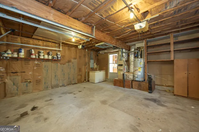 an empty room with a ceiling fan and carpet
