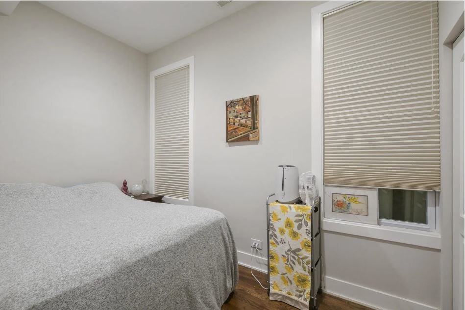 2153 West Potomac Avenue, Unit 2F Chicago, IL 60622 - Photo 11 of 15 a bedroom with a bed and a window