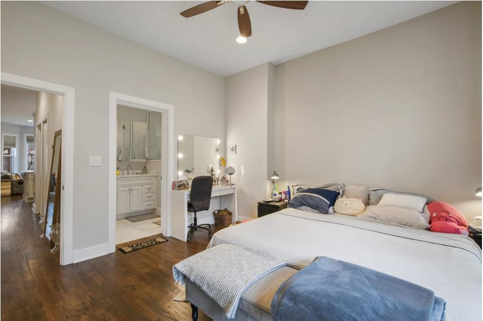 2153 West Potomac Avenue, Unit 2F Chicago, IL 60622 - Photo 8 of 15 a bedroom with a bed and wooden floor