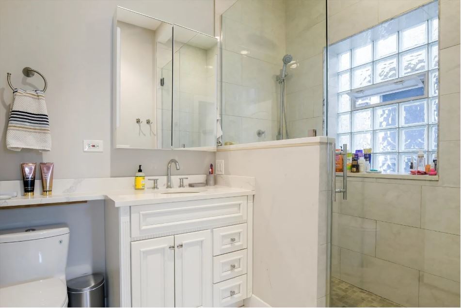 2153 West Potomac Avenue, Unit 2F Chicago, IL 60622 - Photo 10 of 15 a utility room with cabinets washer and dryer