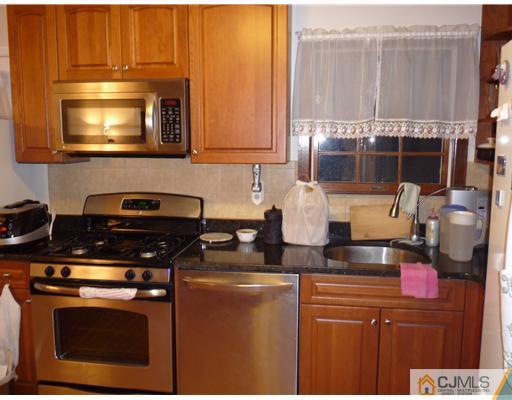 21 Eastlick Road Edison, NJ 08817 - Photo 2 of 8 a kitchen with stainless steel appliances granite countertop a stove a sink and a microwave