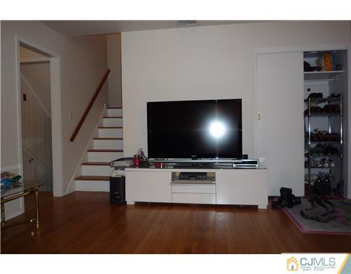 21 Eastlick Road Edison, NJ 08817 - Photo 4 of 8 a living room with furniture and a flat screen tv