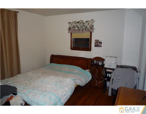 21 Eastlick Road Edison, NJ 08817 - Photo 6 of 8 a bedroom with a bed and a desk