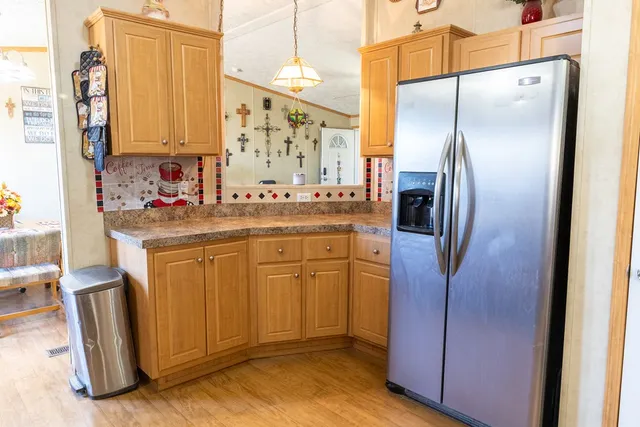 a kitchen with stainless steel appliances a refrigerator and a sink