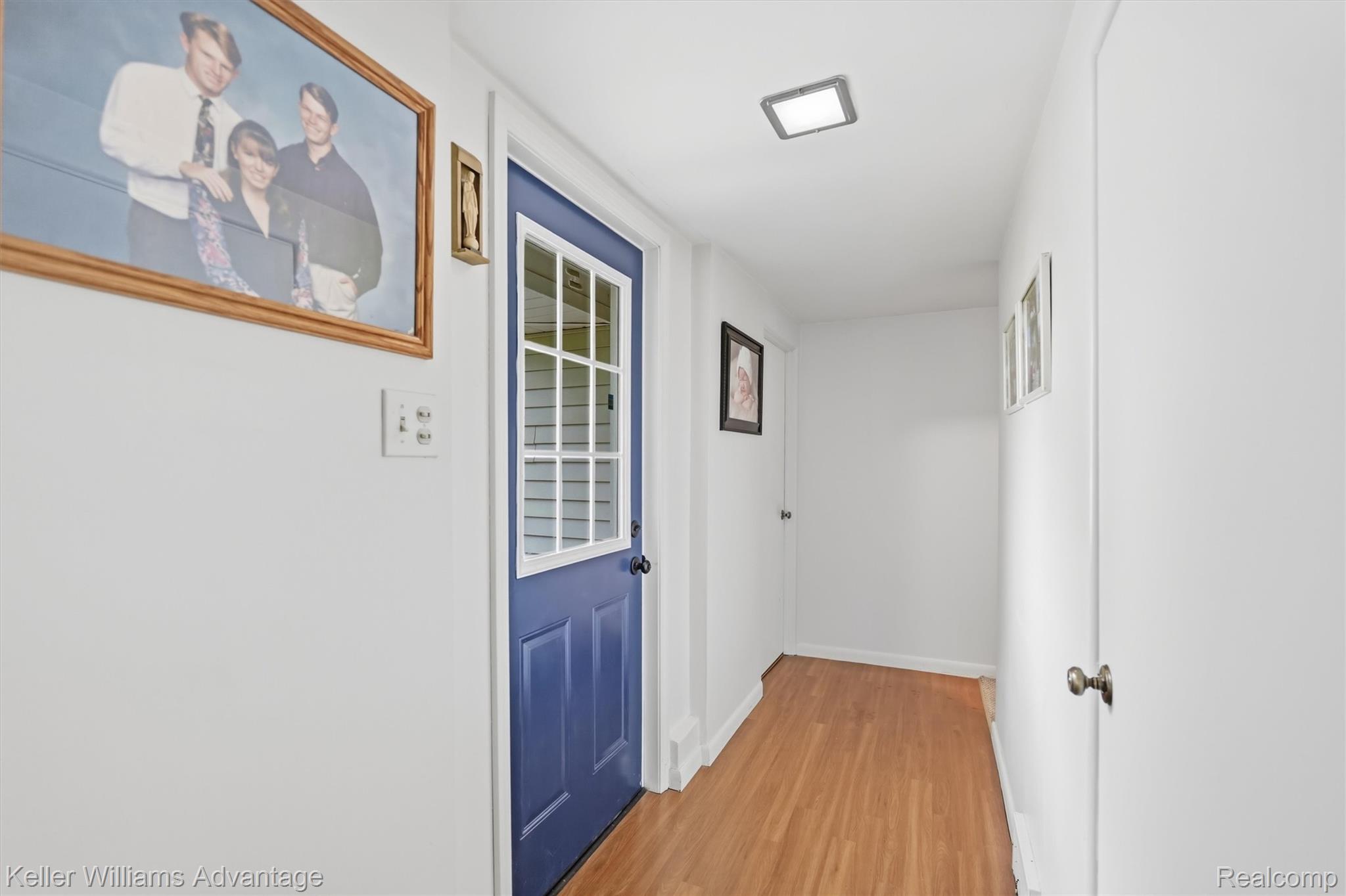 6595 Bray Road Vassar, MI 48768 - Photo 9 of 64 Doorway featuring wood finished floors and baseboards