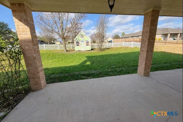 a view of a garden with an outdoor space