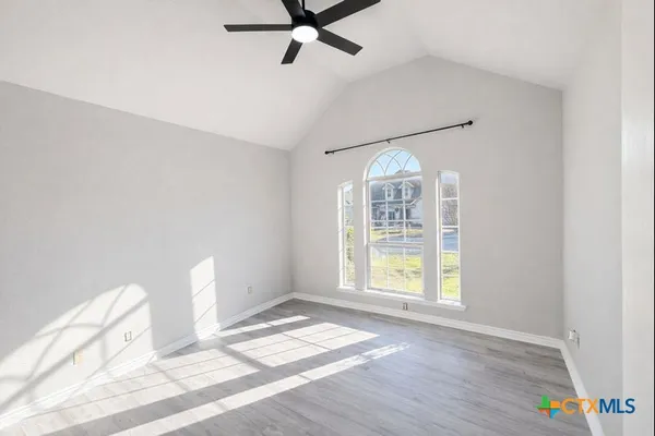 a view of an empty room with a window