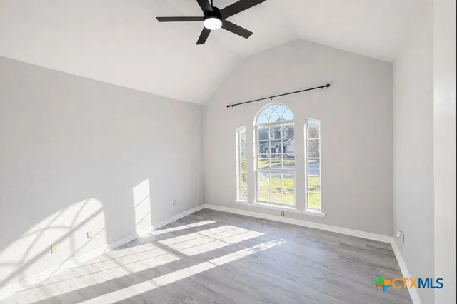 a view of an empty room with a window
