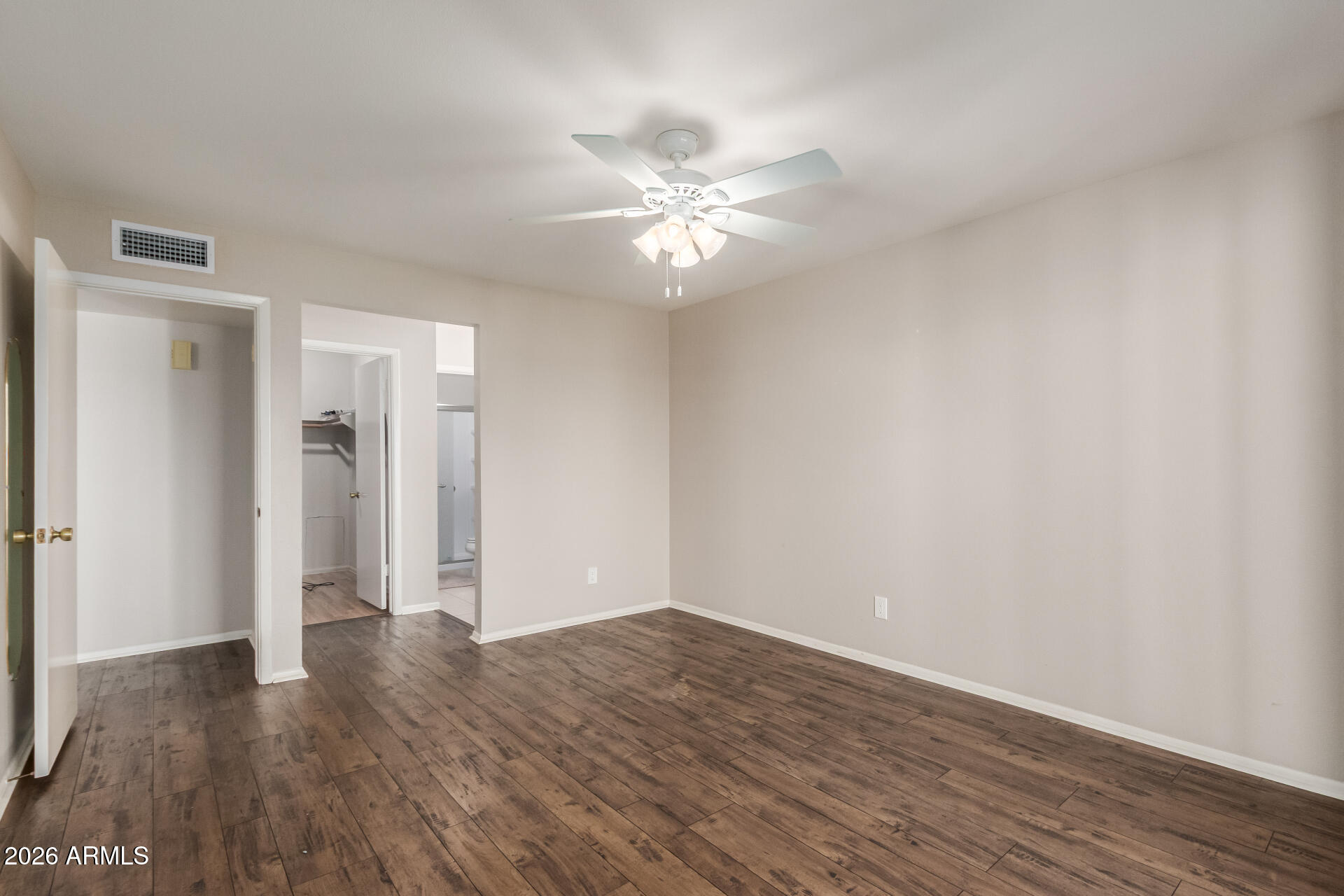 632 South 79th Way Mesa, AZ 85208 - Photo 13 of 30 a view of an empty room with wooden floor