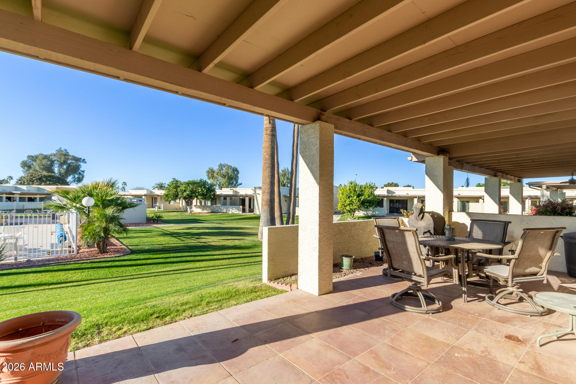 632 South 79th Way Mesa, AZ 85208 - Photo 21 of 30 a view of a patio with table and chairs and potted plants