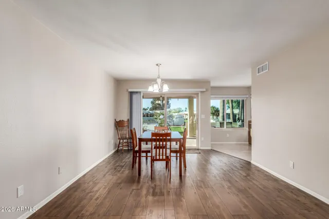 a view of a dining room with furniture window and outside view