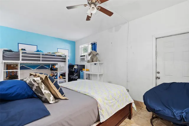 a bedroom with a bed and a chair