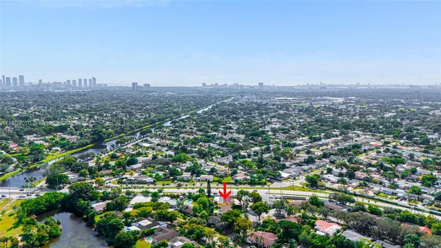 an aerial view of city and green space