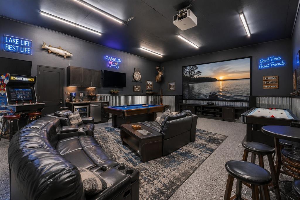 703 Airport Loop Homer, LA 71040 - Photo 25 of 32 a living room with furniture and a flat screen tv