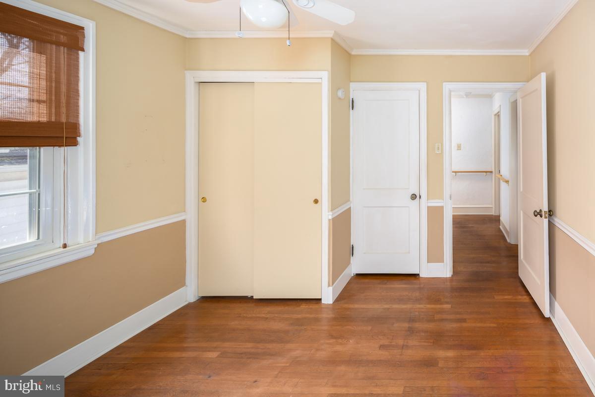 120 Crosshill Road Wynnewood, PA 19096 - Photo 20 of 29 a view of an empty room with wooden floor and a window