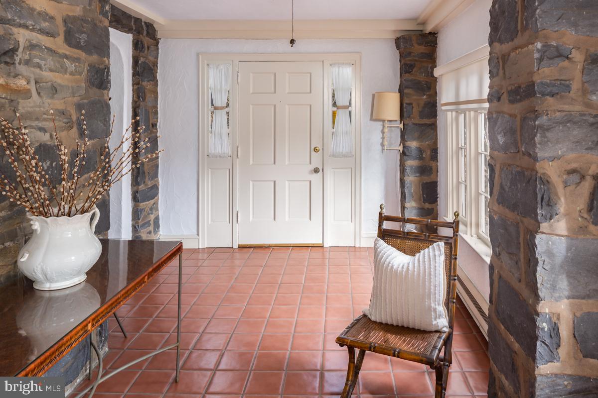 120 Crosshill Road Wynnewood, PA 19096 - Photo 2 of 29 a room with furniture and a potted plant
