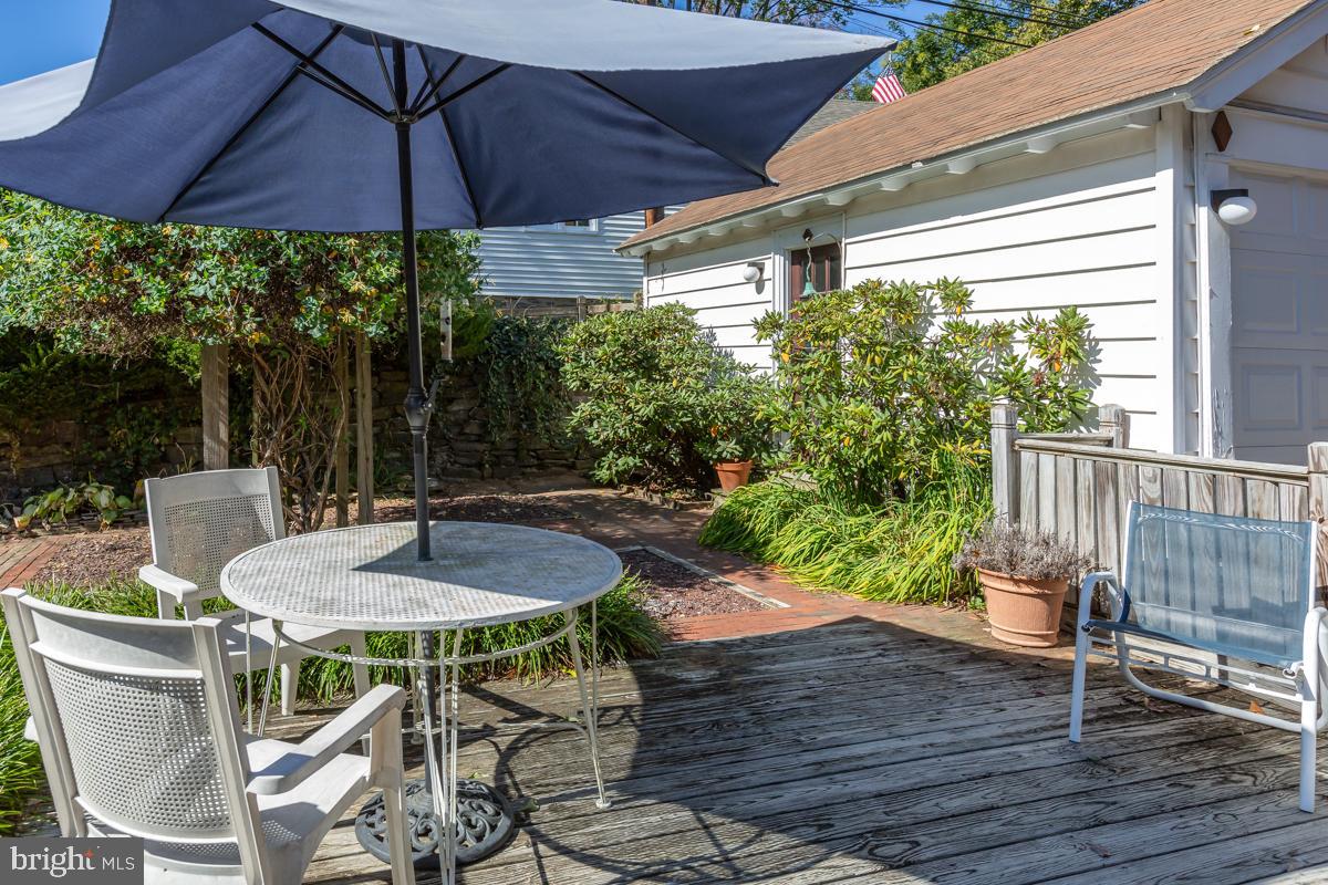 120 Crosshill Road Wynnewood, PA 19096 - Photo 27 of 29 a patio with wooden floor table and chairs