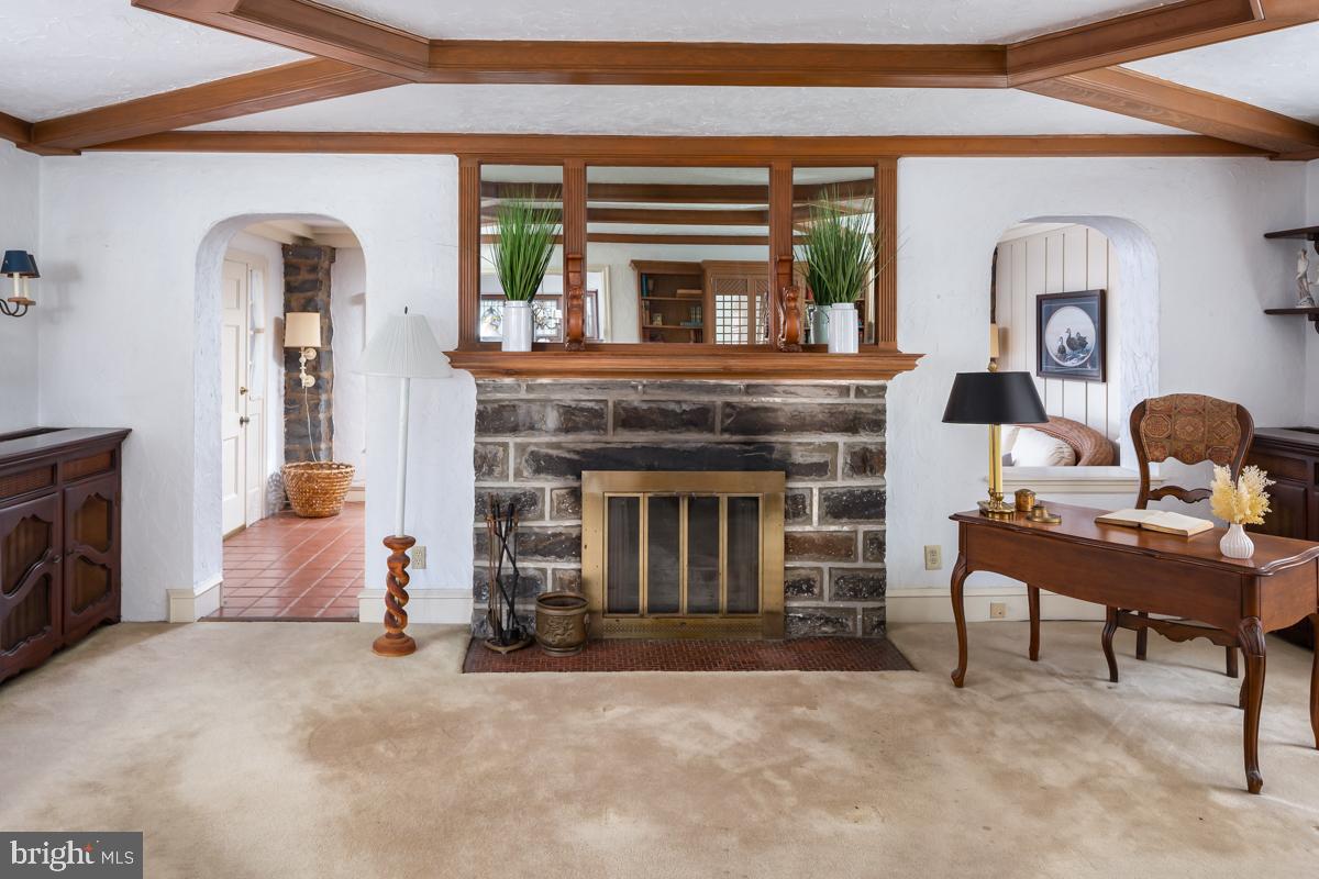 120 Crosshill Road Wynnewood, PA 19096 - Photo 5 of 29 a living room with furniture and a fireplace