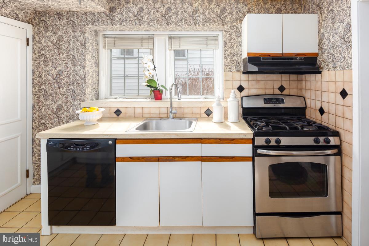 120 Crosshill Road Wynnewood, PA 19096 - Photo 9 of 29 a kitchen with a stove and a sink