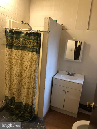 a bathroom with a sink and mirror