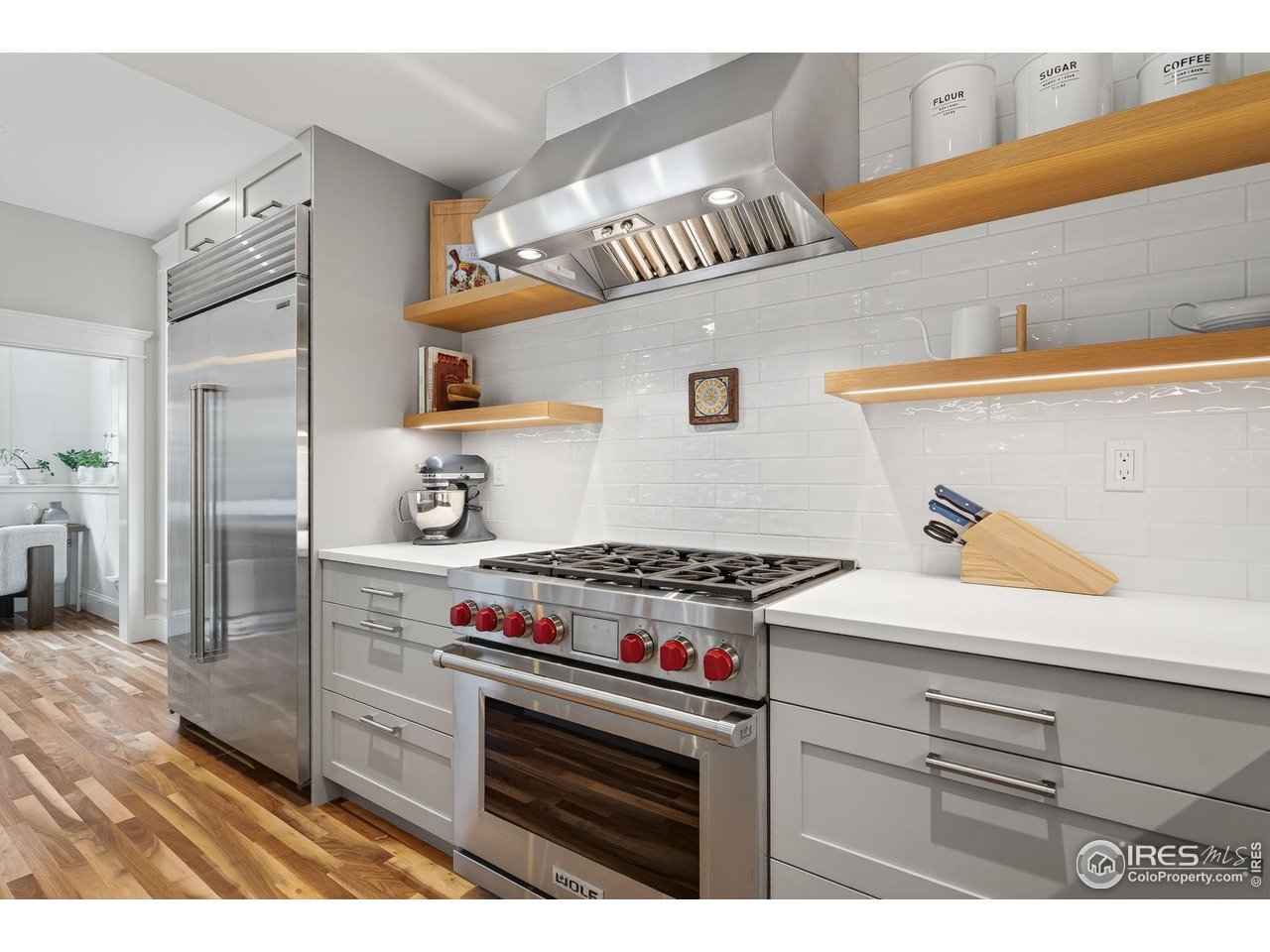 1719 Mapleton Avenue Boulder, CO 80304 - Photo 11 of 50 a kitchen with stainless steel appliances granite countertop a stove and a cabinets