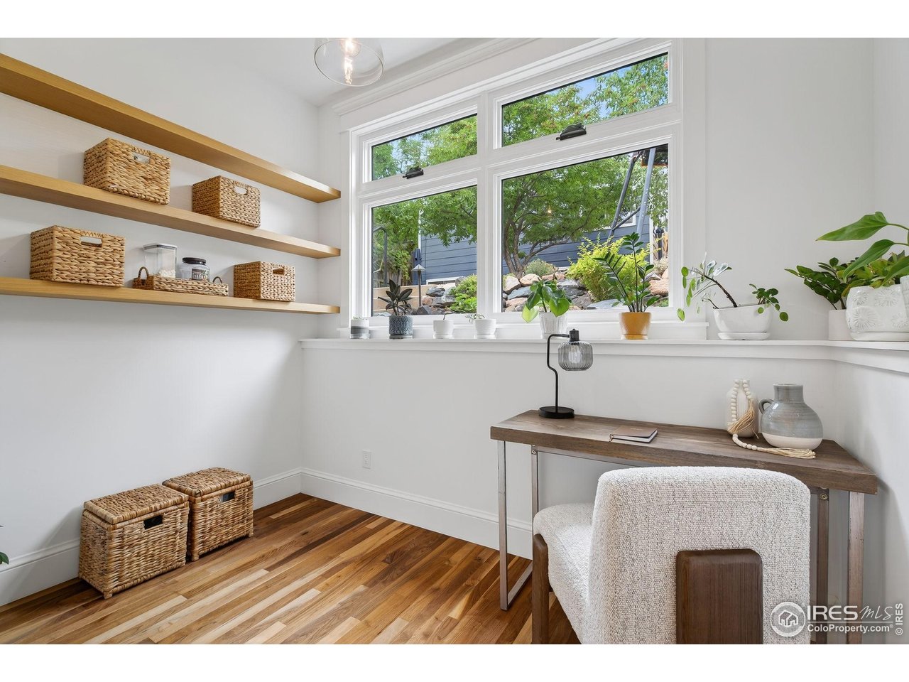 1719 Mapleton Avenue Boulder, CO 80304 - Photo 12 of 50 a bedroom with a bed and a window