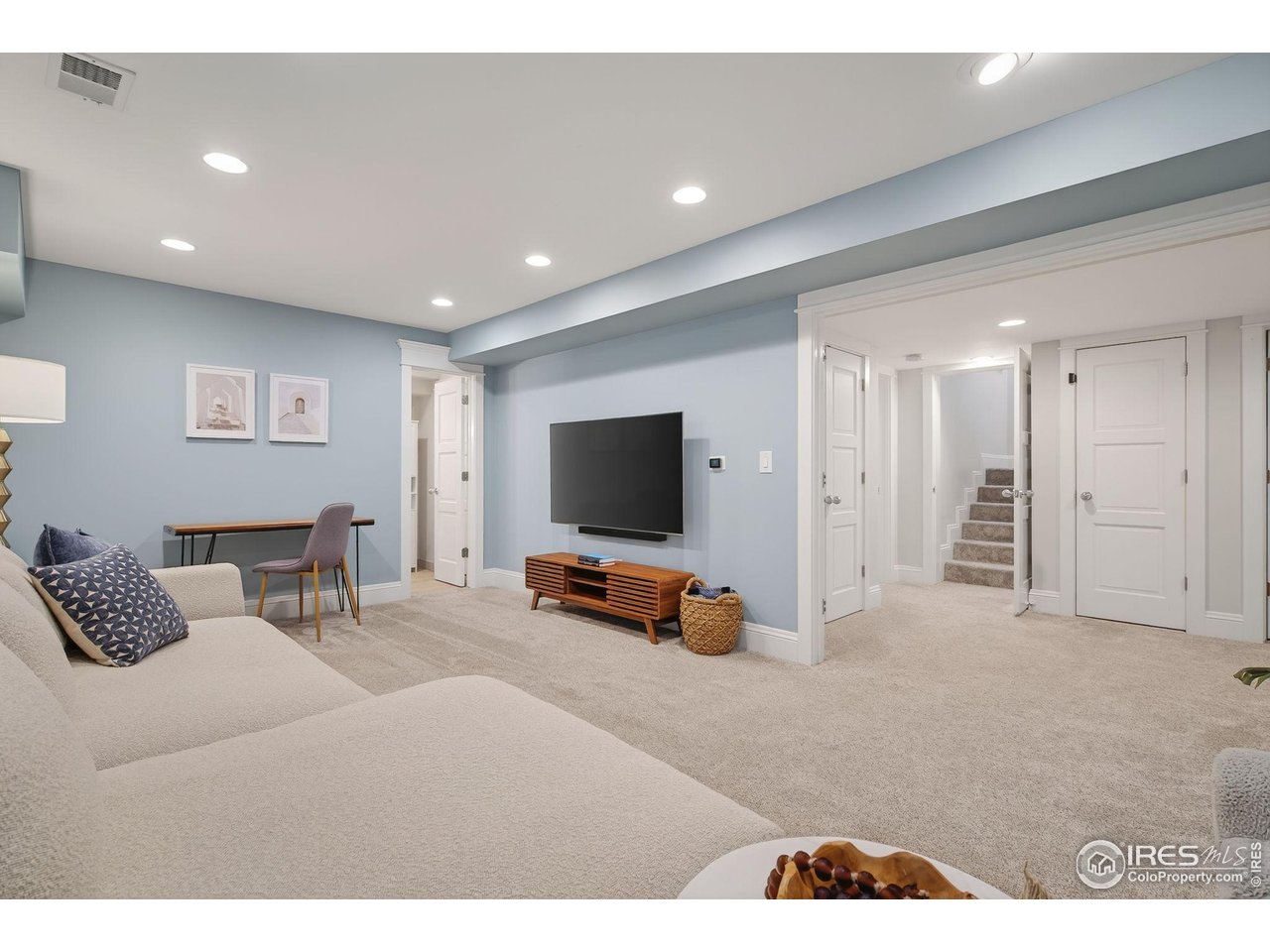 1719 Mapleton Avenue Boulder, CO 80304 - Photo 26 of 50 a living room with furniture and a flat screen tv