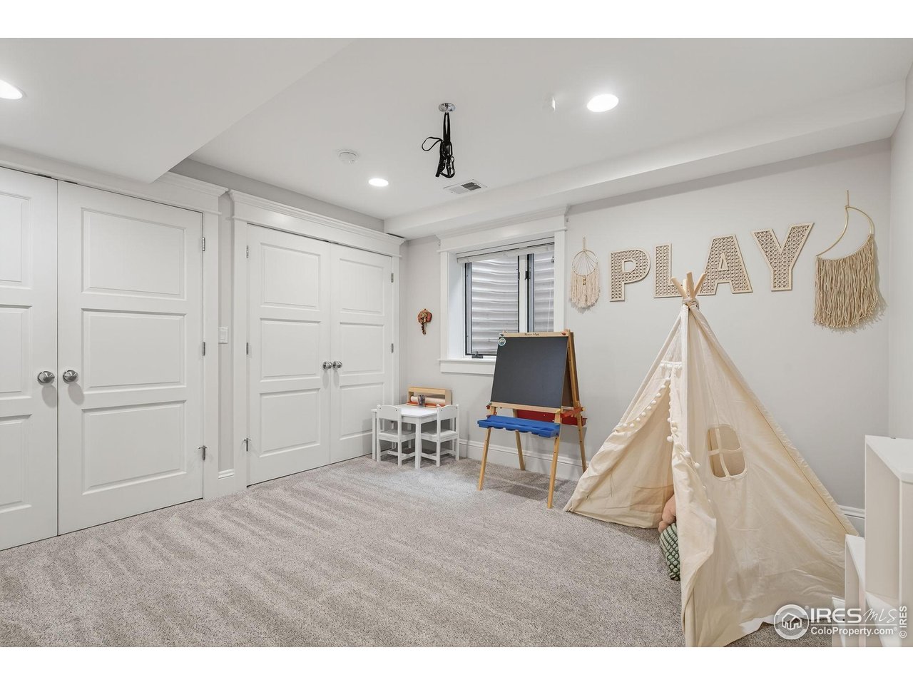 1719 Mapleton Avenue Boulder, CO 80304 - Photo 27 of 50 a view of a livingroom with furniture and a window