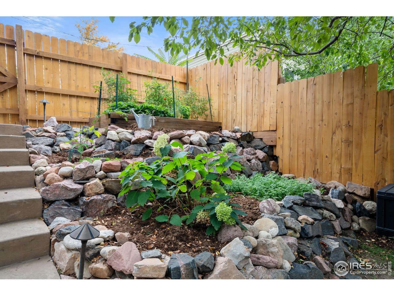 1719 Mapleton Avenue Boulder, CO 80304 - Photo 34 of 50 a view of a backyard with sitting area