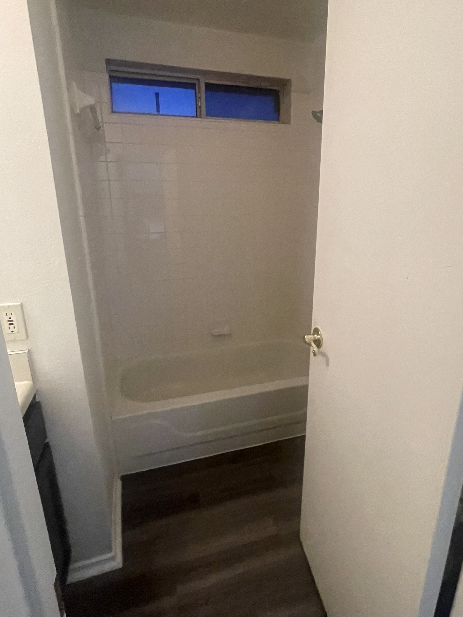 221 Britni Loop Kyle, TX 78640 - Photo 16 of 20 Full bathroom featuring dark wood finished floors, vanity, and bathing tub / shower combination