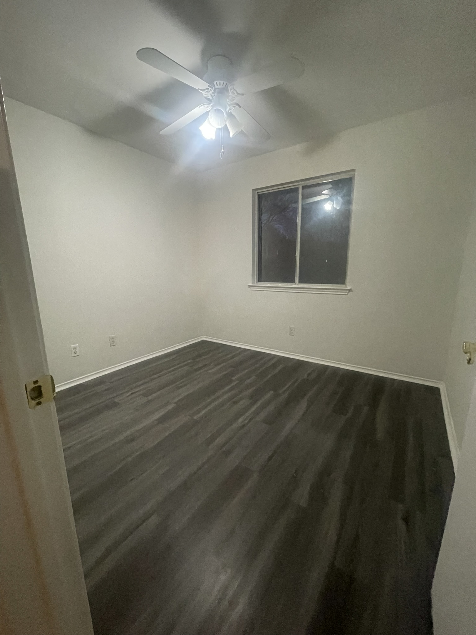 221 Britni Loop Kyle, TX 78640 - Photo 17 of 20 Spare room featuring dark wood finished floors and a ceiling fan