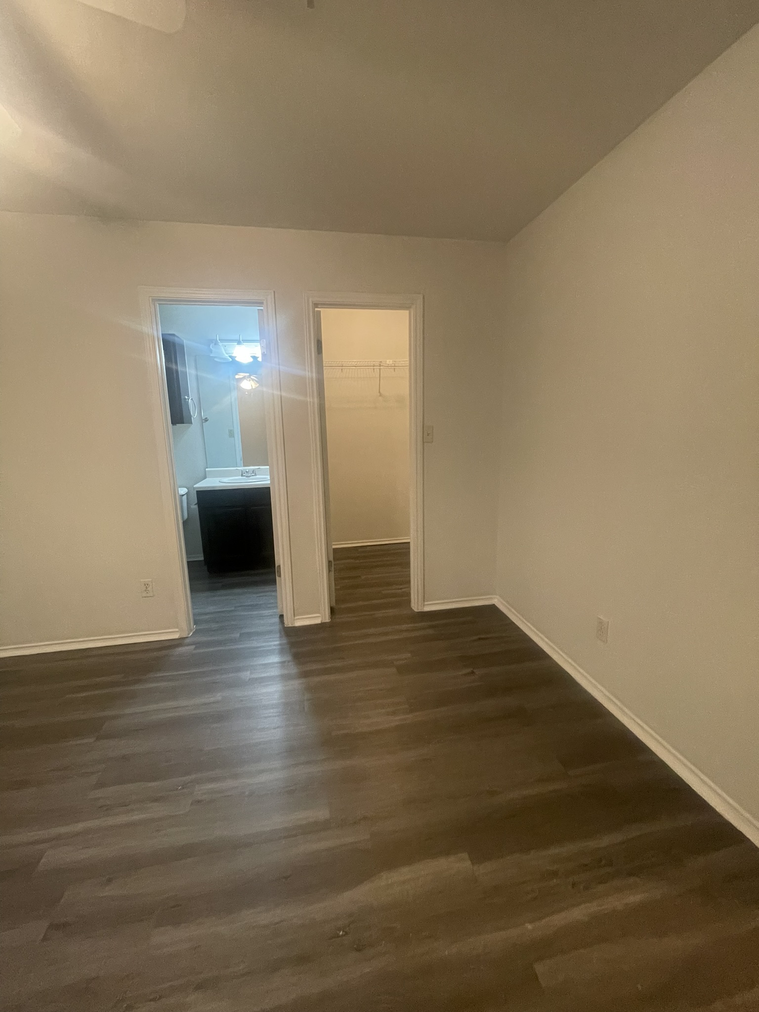 221 Britni Loop Kyle, TX 78640 - Photo 7 of 20 Spare room with dark wood finished floors and baseboards