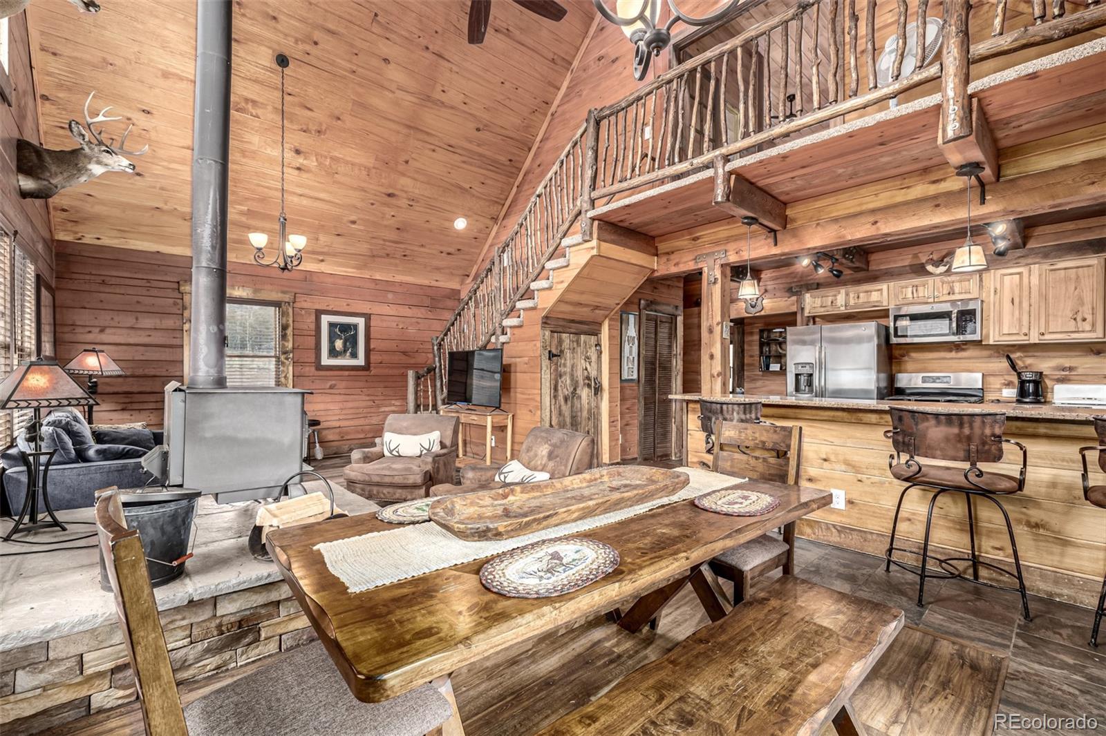 116 Dakota Path Lake George, CO 80827 - Photo 12 of 38 a roof deck with table and chairs