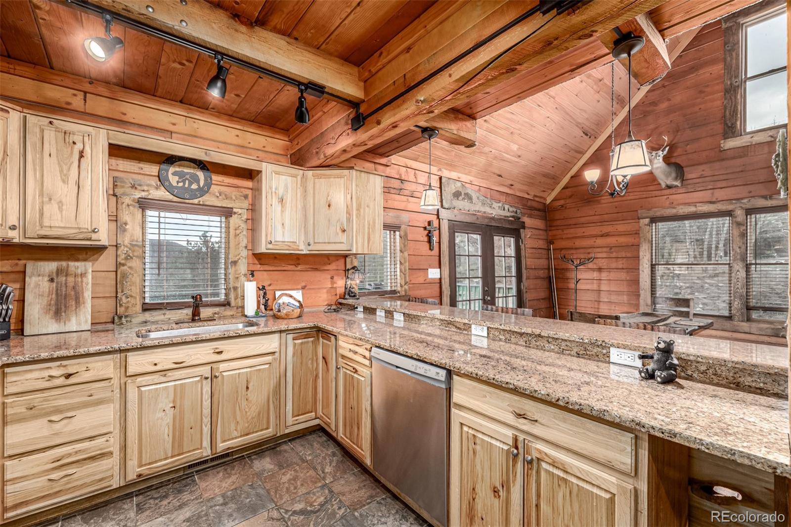 116 Dakota Path Lake George, CO 80827 - Photo 18 of 38 a kitchen with a sink stove and cabinets