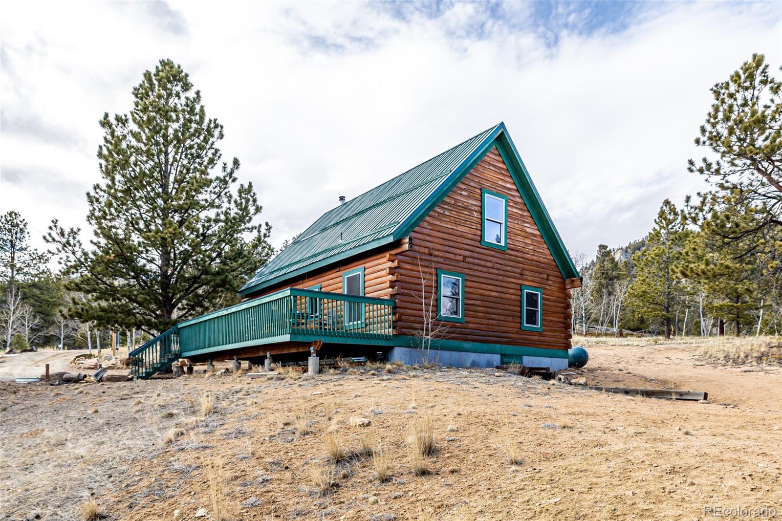 116 Dakota Path Lake George, CO 80827 - Photo 2 of 38 a front view of a house with a yard