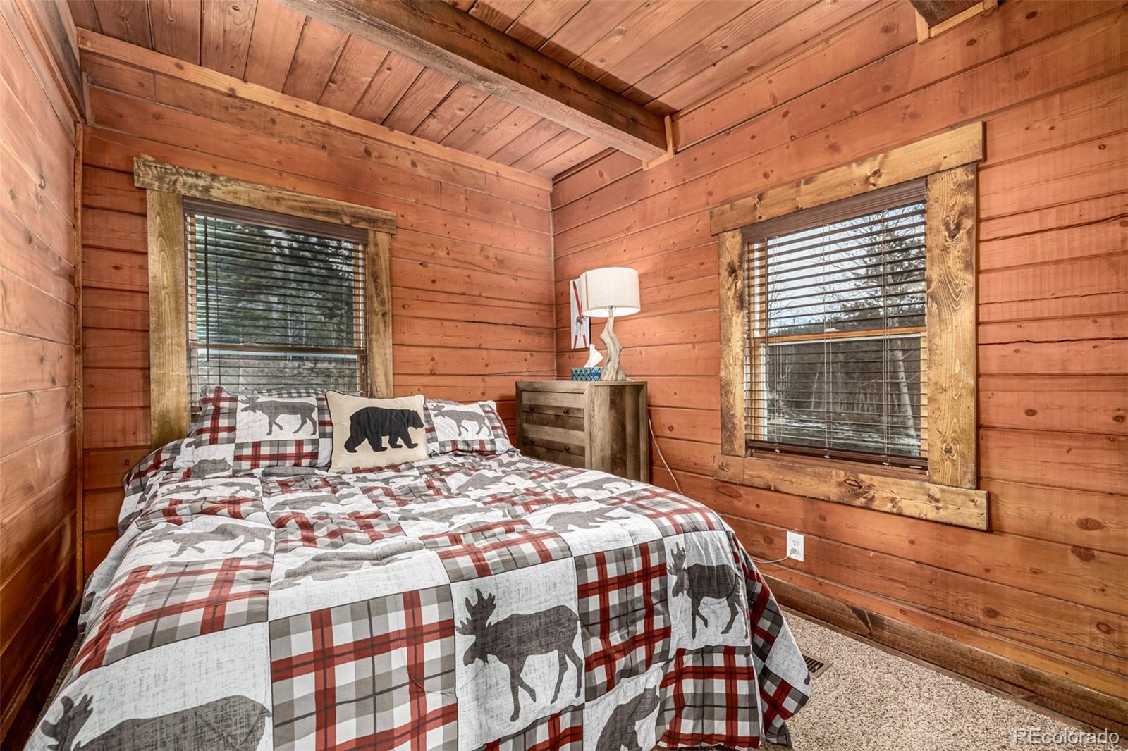 116 Dakota Path Lake George, CO 80827 - Photo 26 of 38 a view of a patio with table and chairs with wooden floor and fence