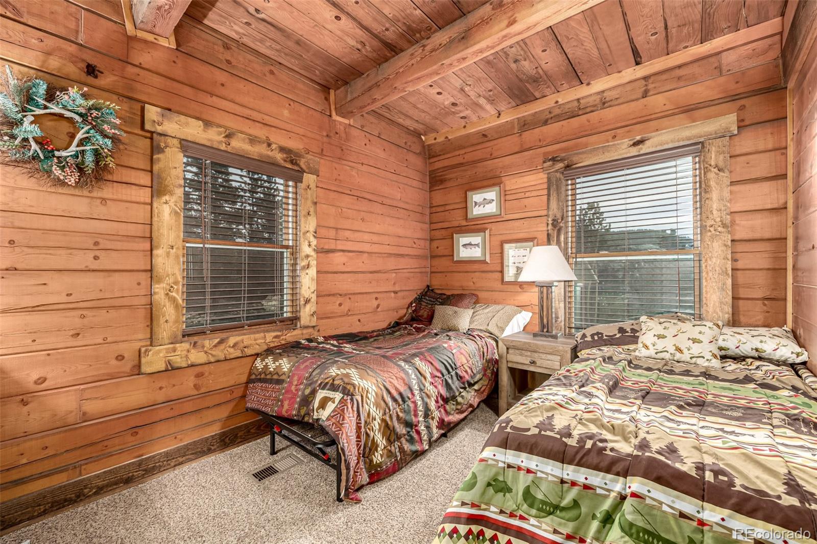 116 Dakota Path Lake George, CO 80827 - Photo 28 of 38 a view of a bedroom with two beds and a window