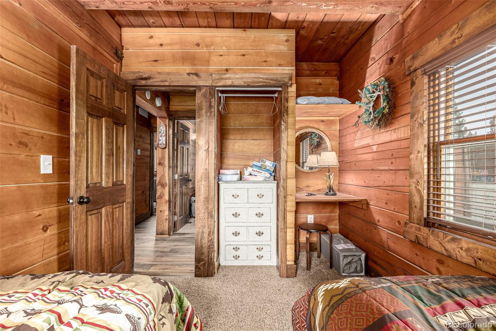 116 Dakota Path Lake George, CO 80827 - Photo 29 of 38 a view of a bedroom with bed and balcony