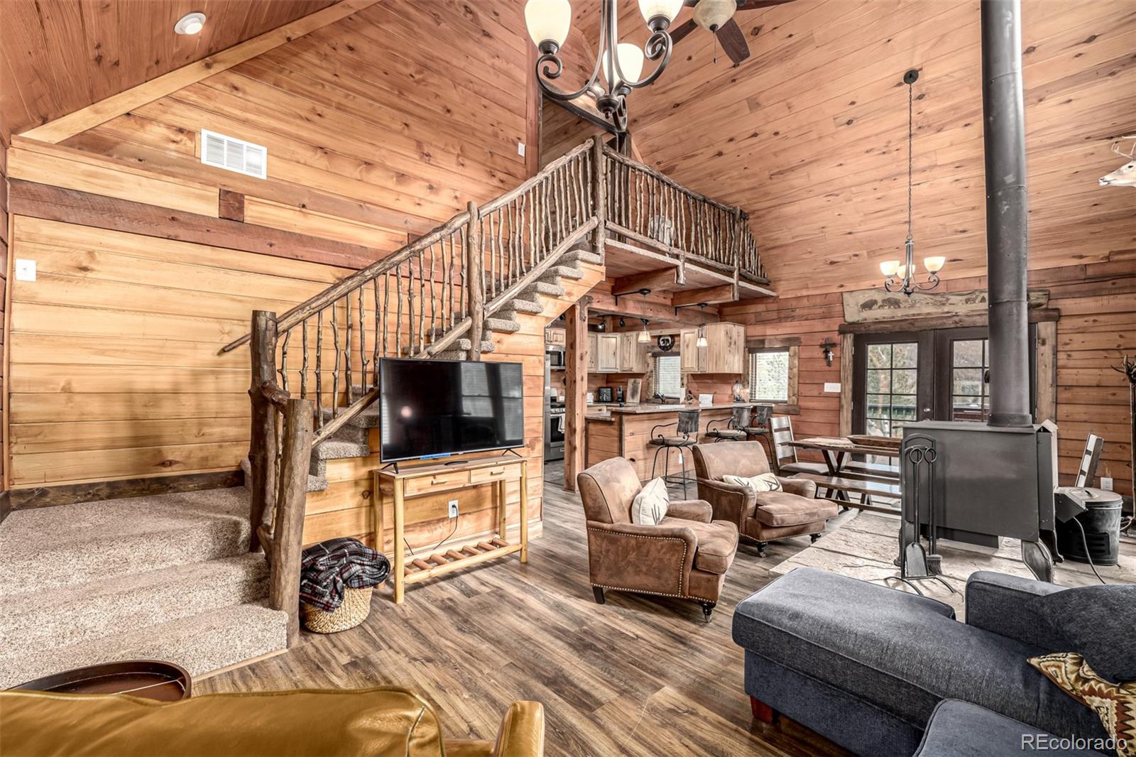 116 Dakota Path Lake George, CO 80827 - Photo 10 of 38 a living room with furniture and a flat screen tv