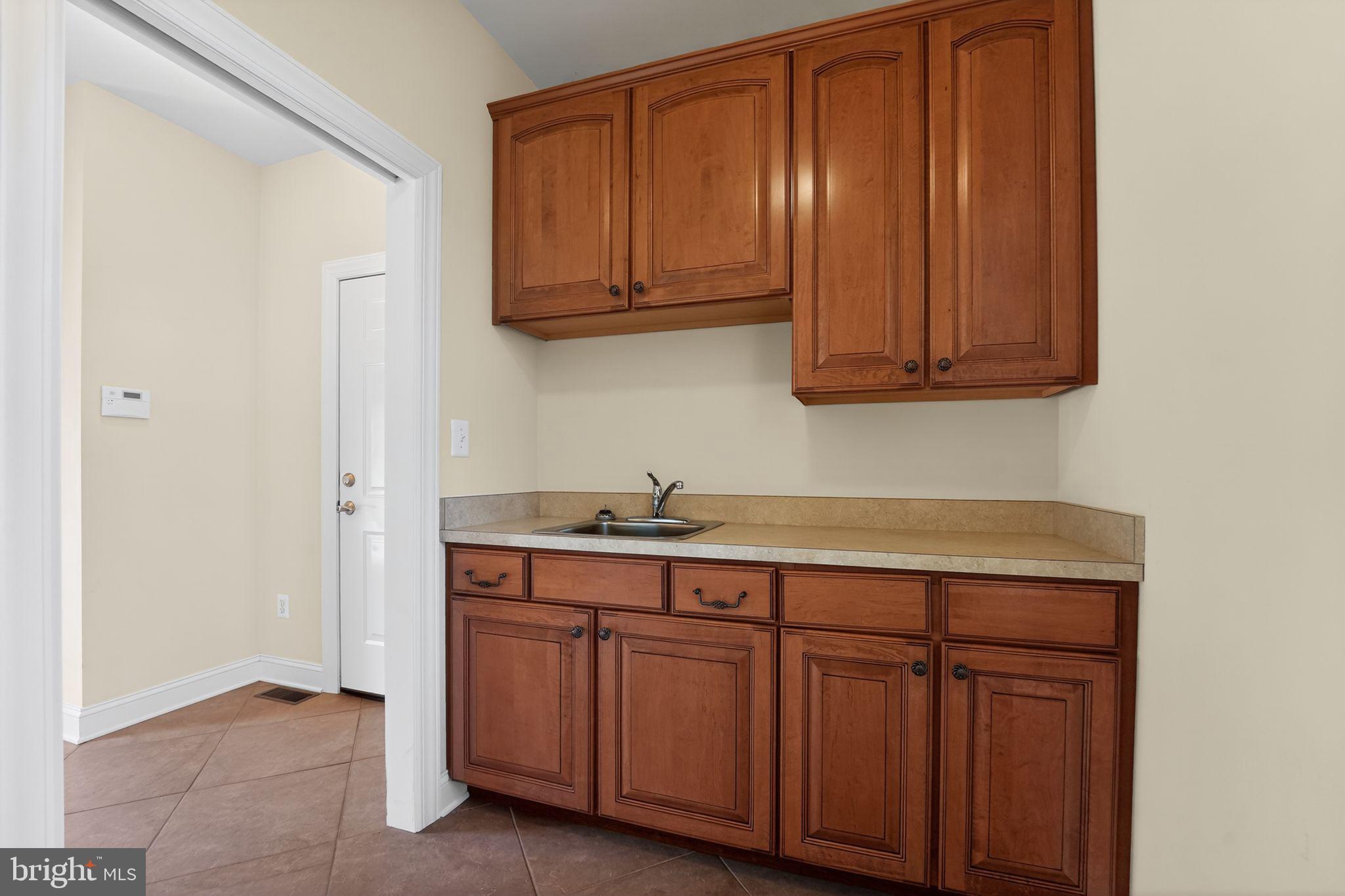 1165 Line Road Westminster, MD 21158 - Photo 44 of 75 a kitchen with stainless steel appliances granite countertop a sink and cabinets