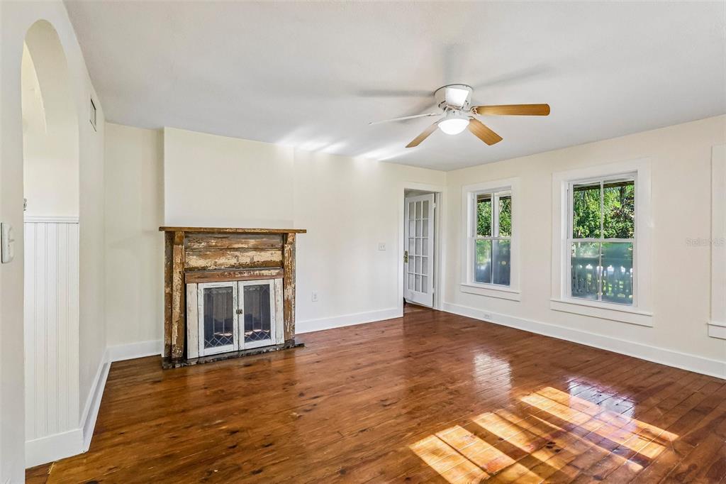 1190 Old Mt Dora Road Eustis, FL 32726 - Photo 14 of 69 a view of an empty room with window and wooden floor