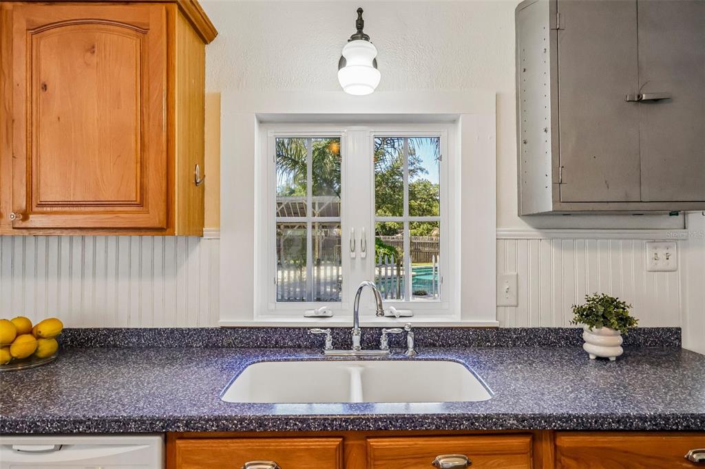 1190 Old Mt Dora Road Eustis, FL 32726 - Photo 26 of 69 a kitchen with granite countertop a sink a window and stainless steel appliances