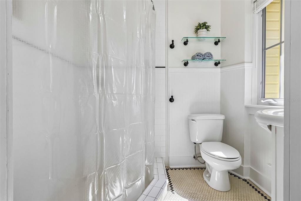 1190 Old Mt Dora Road Eustis, FL 32726 - Photo 39 of 69 a white toilet sitting next to a bathroom sink