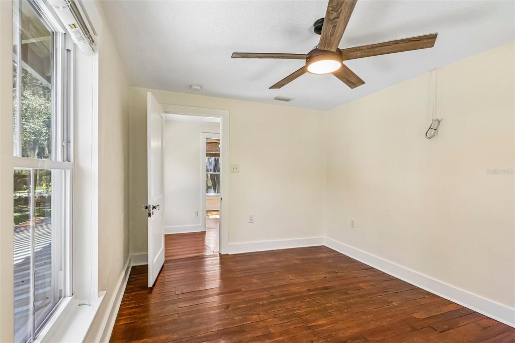1190 Old Mt Dora Road Eustis, FL 32726 - Photo 48 of 69 wooden floor in an empty room with a window