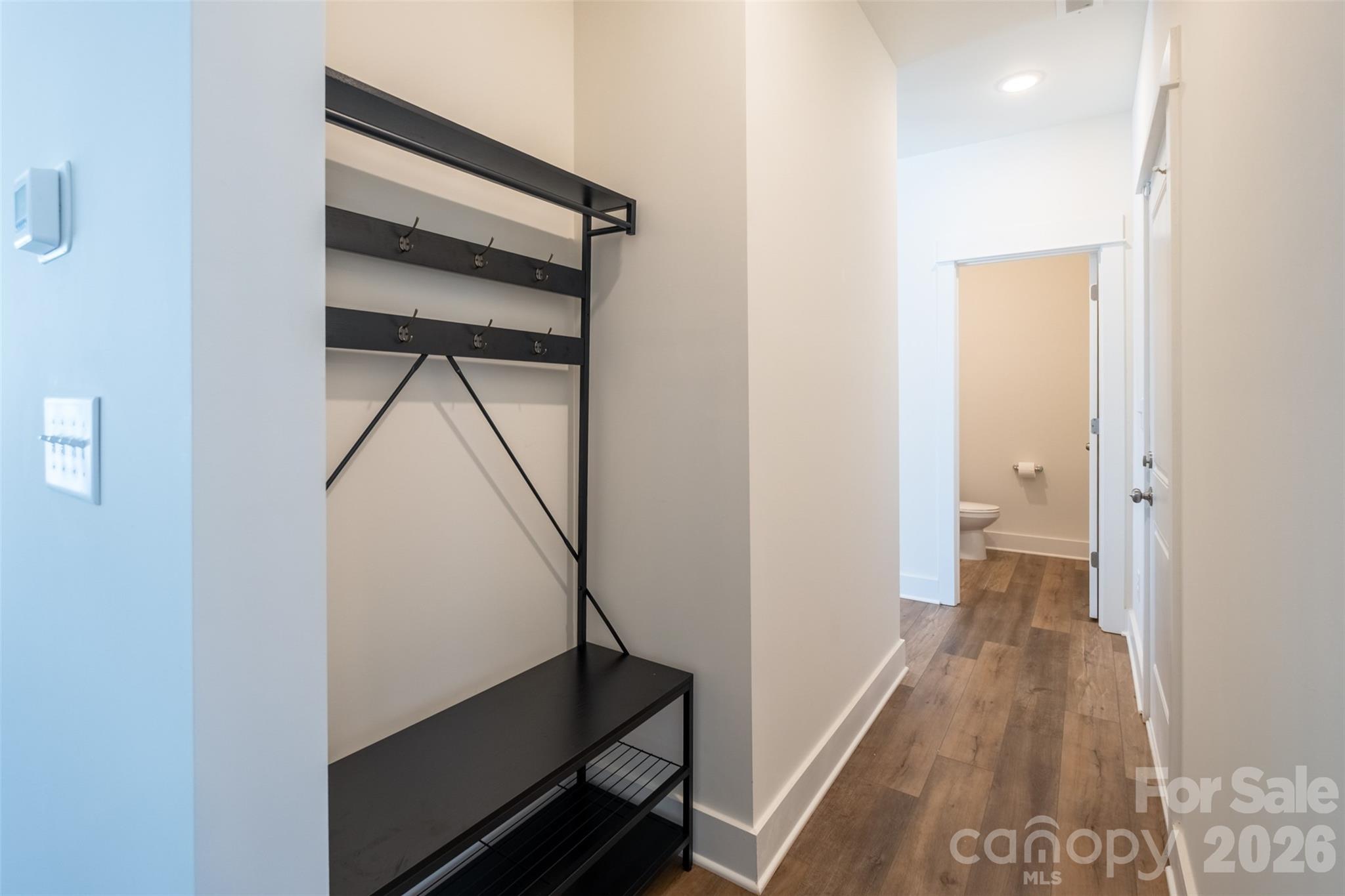 220 Sugar Hill Road Troutman, NC 28166 - Photo 16 of 37 a view of a hallway with wooden floor and entryway