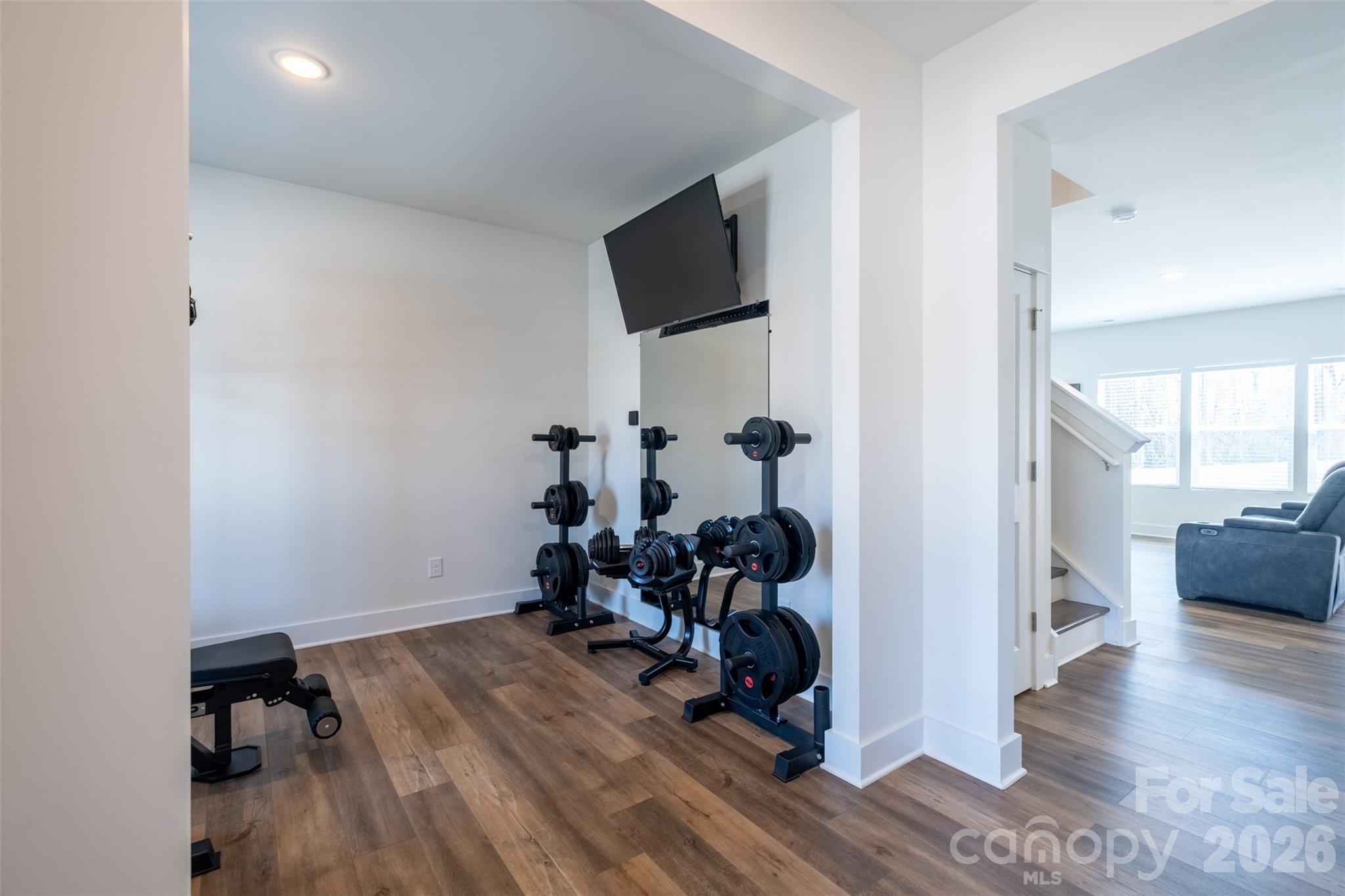 220 Sugar Hill Road Troutman, NC 28166 - Photo 7 of 37 a view of a room with wooden floor and furniture