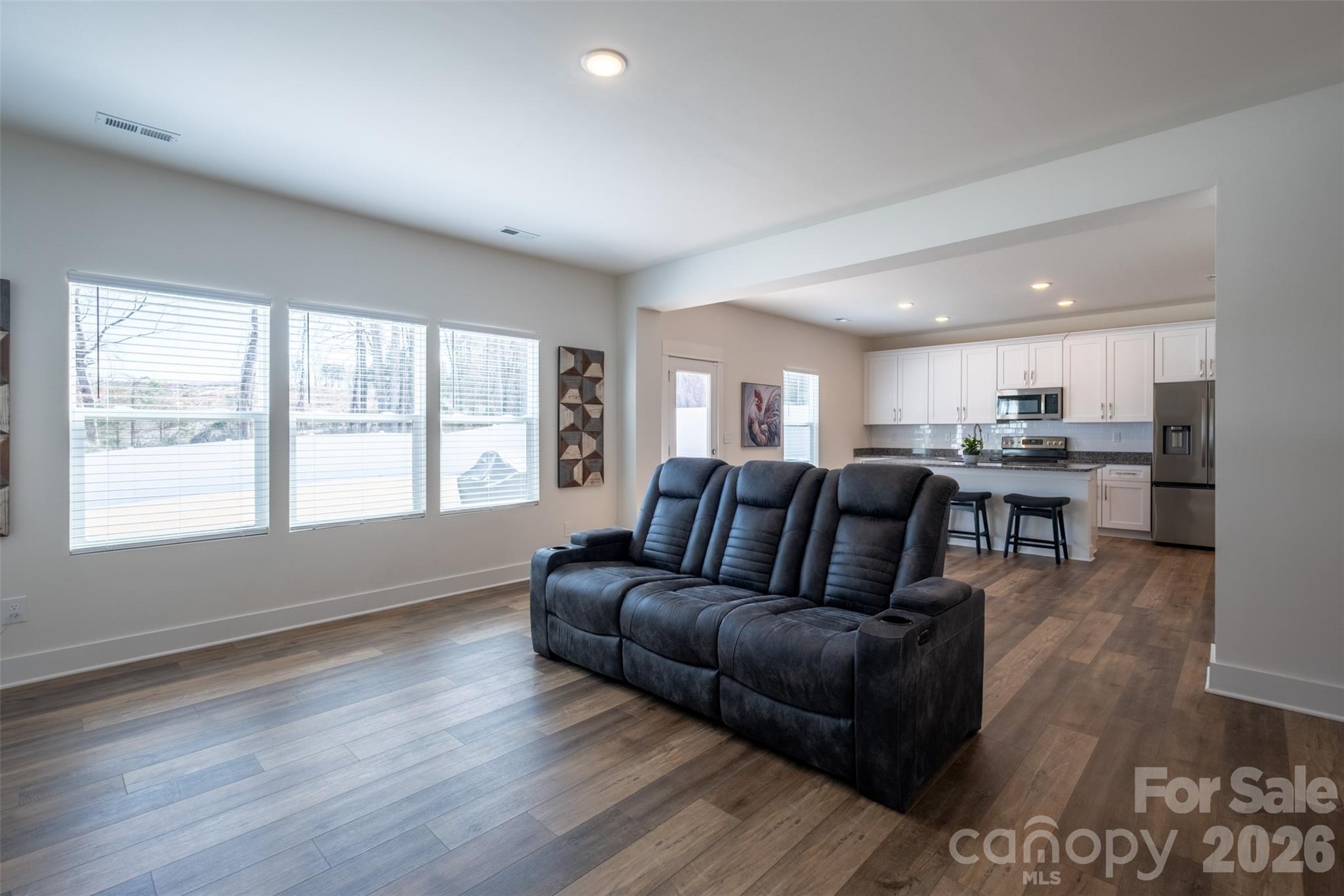 220 Sugar Hill Road Troutman, NC 28166 - Photo 10 of 37 a living room with furniture and a large window