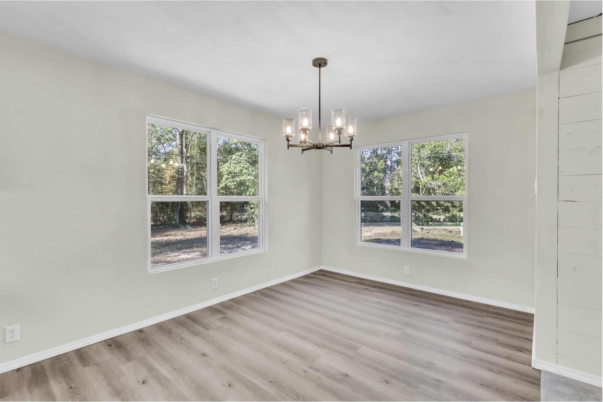 180 Friar Tuck Drive Ivanhoe, TX 75979 - Photo 18 of 31 a view of an empty room with wooden floor and a window