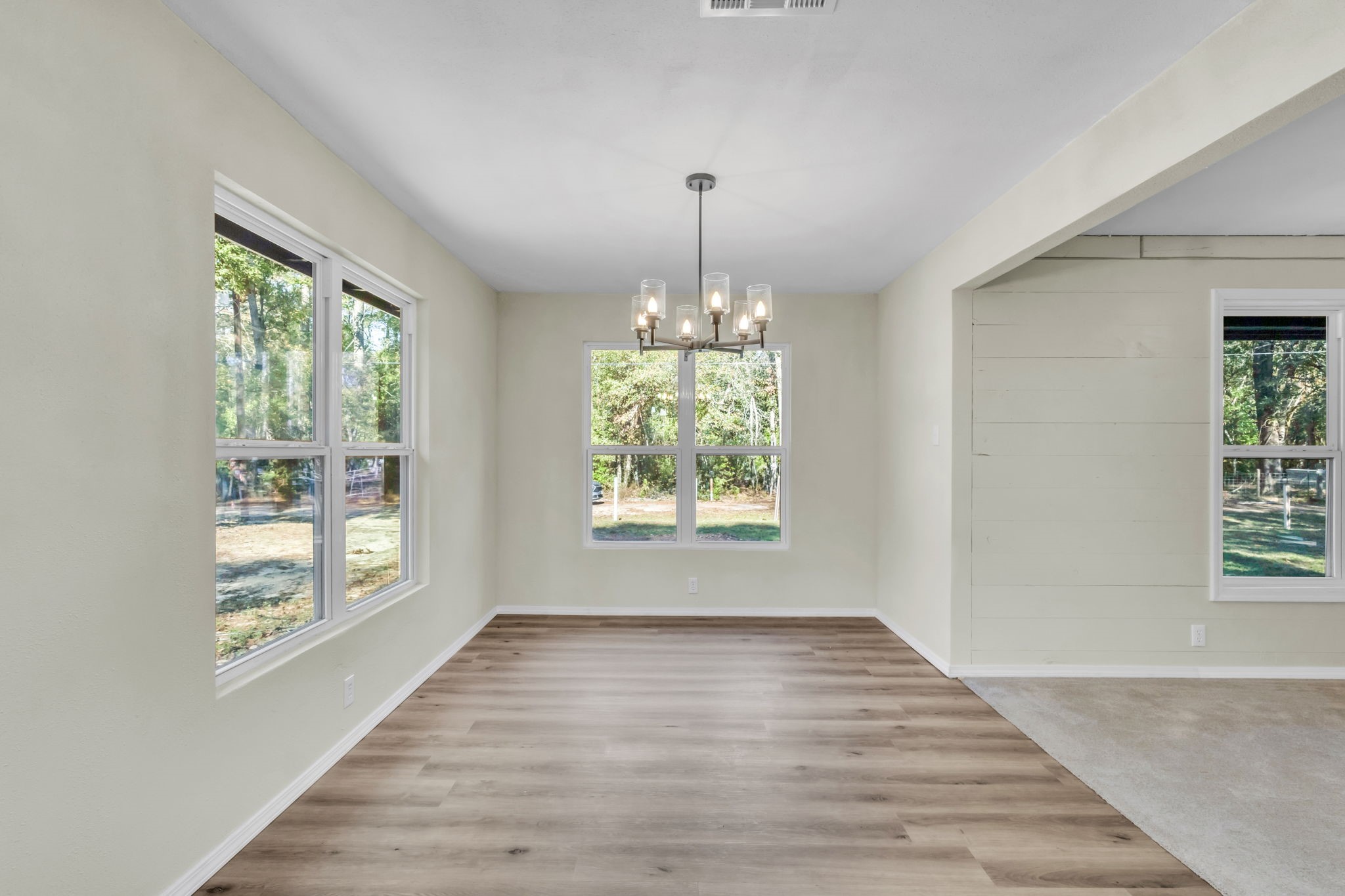 180 Friar Tuck Drive Ivanhoe, TX 75979 - Photo 20 of 31 a view of an empty room with wooden floor and a window